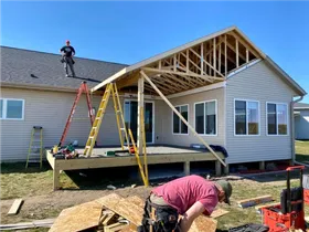 men framing a house