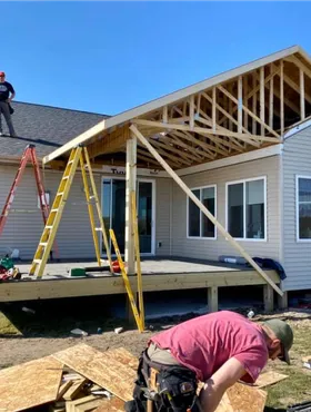 men framing a house